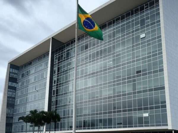 Edifício do TJDFT em Brasília com bandeira a meio mastro, simbolizando luto por morte de desembargador.